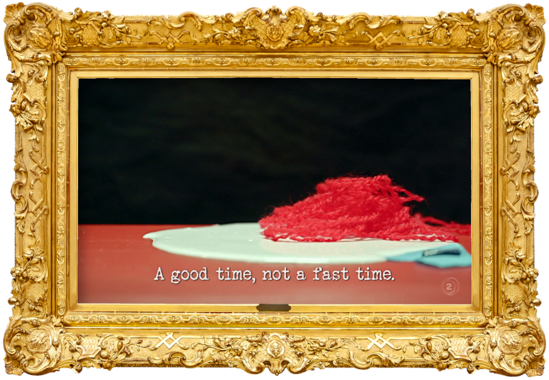 Image of a pool of PVA glue and a small pile of red yarn (a reference to David, Guy and Laura's attempt at the 'Perform an educational puppet show' task), with the episode title, 'A good time, not a fast time', superimposed on it.