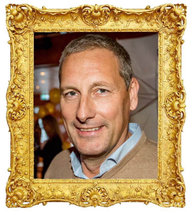 Headshot photo of Gert Verhulst surrounded with an ornate golden frame.