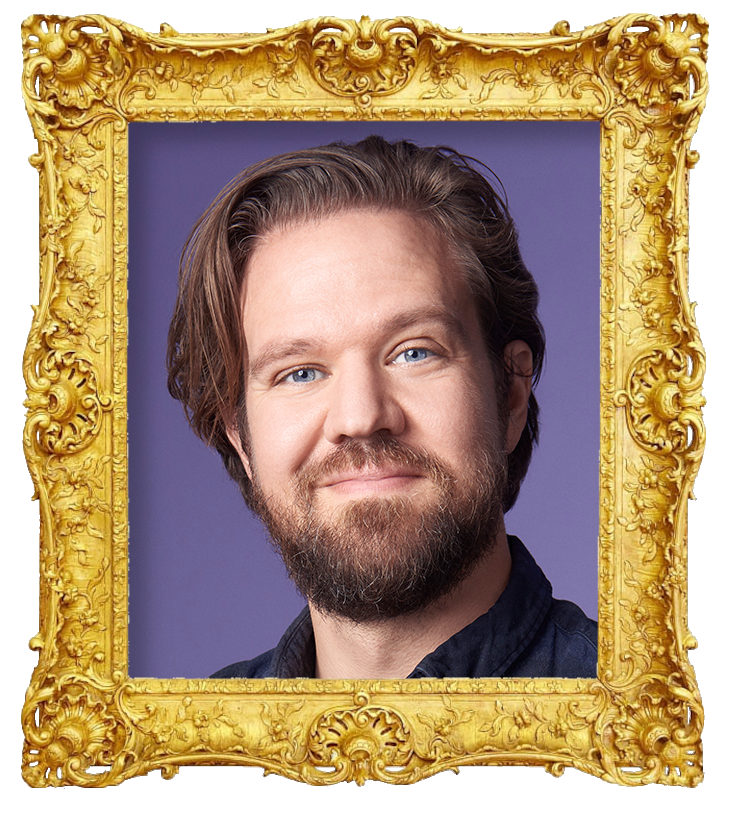 Headshot photo of Thomas Warberg surrounded with an ornate golden frame.