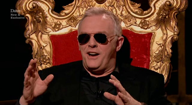 Image of Greg realising that the sunglasses that Frank has bought him have small wing-mirrors, allowing him to see behind himself.