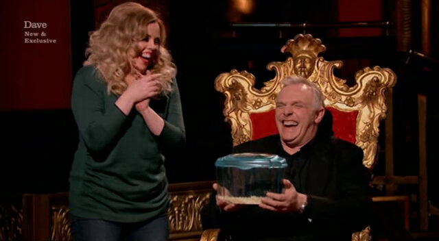 Image of Greg receiving a live pet mouse from Roisin Conaty.