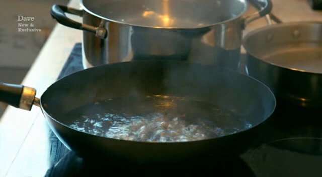 Image of multiple pots of boiling water on a cooker hob.