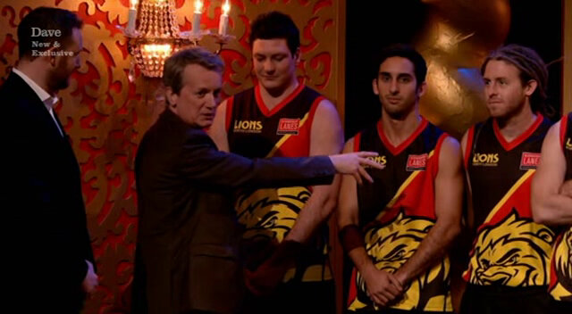 Image of Frank Skinner trying to correctly introduce three members of an Australian Rules Football team.