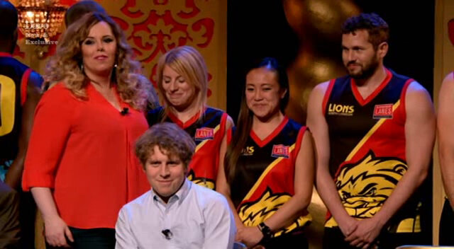 Image of Roisin Conaty trying to correctly introduce three members of an Australian Rules Football team.