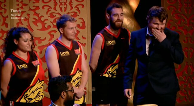 Image of Tim Key trying to correctly introduce three members of an Australian Rules Football team (and failing to keep a straight face at the name ‘Yank Tank’).