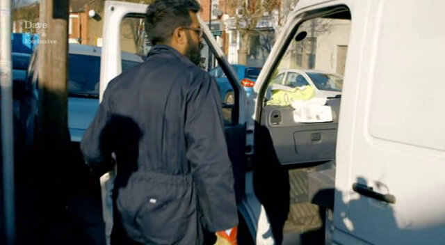 Image of Romesh Ranganathan briefing Mo the white van man on his mission to get a fake boulder as far away as possible in the next 10 minutes.