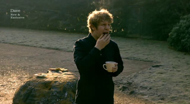 Image of Josh Widdicombe killing time with a nice cup of tea and a biscuit, while he waits for the taxi to arrive.