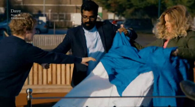 Image showing Roisin Conaty, Romesh Ranganathan, and Josh Widdicombe trying to make a bed together while holding hands.