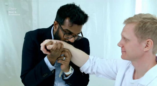 Image showing Romesh Ranganathan kissing the hand of a Swedish man in an attempt to embarrass him.