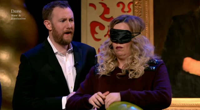 Image of Roisin Conaty tying her inflated balloon as Alex oversees matters behind her.
