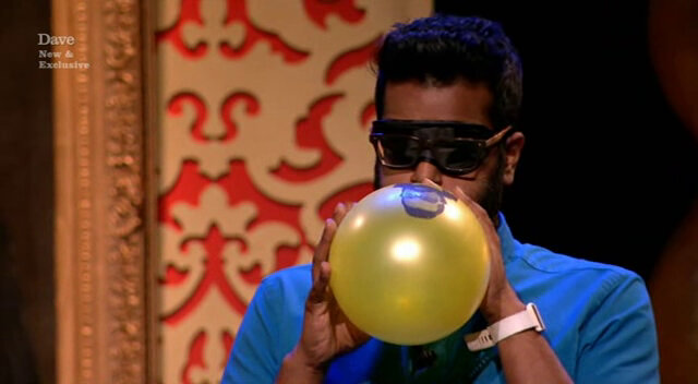 Image of Romesh Ranganathan inflating his balloon.