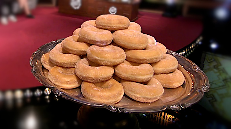 Image of the prize up for grabs in this episode: a tray of three dozen doughnuts.