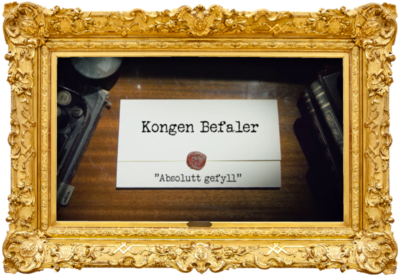 Image of the title card at the start of this episode, showing a task brief with the show title, 'Kongen Befaler', and the episode title, 'Absolutt gefyll' ['Absolutely filled'], on a wooden desk. At the edges of the image, part of a typewriter keyboard and a stack of leather-bound books can be seen.