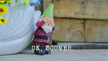 Image of a garden gnome covering its eyes (it's unknown what this might be a reference to), with the episode title, 'OK Boomer', superimposed on it.