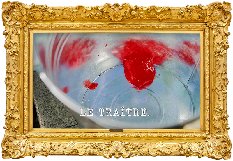 Image of a red Jell-O cup at the bottom of a metal bucket (a reference to the 'Eat one item, balance one item, throw one item' task), with the episode title, 'Le traître' ['The traitor'], superimposed on it.