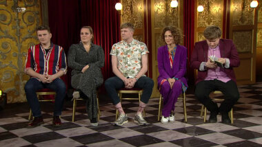 Image of the panel of contestants seated on stage together during this episode.