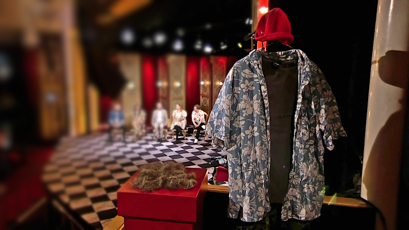 Image of the prize for this episode: Anders Lund Madsen’s ‘old self’, represented by a blue and white Hawaiian print shirt, a red cap, and the hair he has had trimmed from his head.