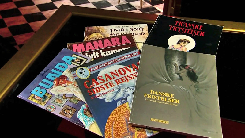 Image of the prize in this episode: a collection of erotic comic books from the 1980s.