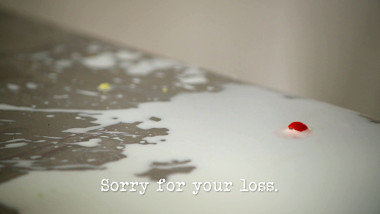 Image of milk spilled over a stainless steel table (a reference to the 'Throw a tantrum' task), with the episode title, 'Sorry for your loss', superimposed on it.