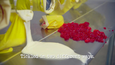 Image of mayonnaise and red jelly spilled on a stainless steel table (a reference to Aaron Chen's attempt at the ‘Identify the contents of the gloves’ task), with the episode title, ‘Tickled in two different ways’, superimposed on it.