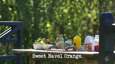 Image of a table loaded with food and drink (it's unclear whether this is a reference to anything from the episode), with the episode title, 'Sweet Navel Orange', superimposed on it.