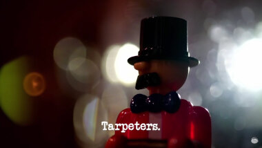 Image of the head and shoulders of the little plastic man used in the 'Take the wind-up man on an adventure' task, with the episode title, 'Tarpeters', superimposed on it.