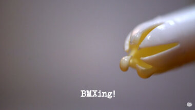 Image of the plastic nozzle of a can of squirty cream (a reference to the 'Make the best squirty cream art' task), with the episode title, 'BMXing!', superimposed on it.