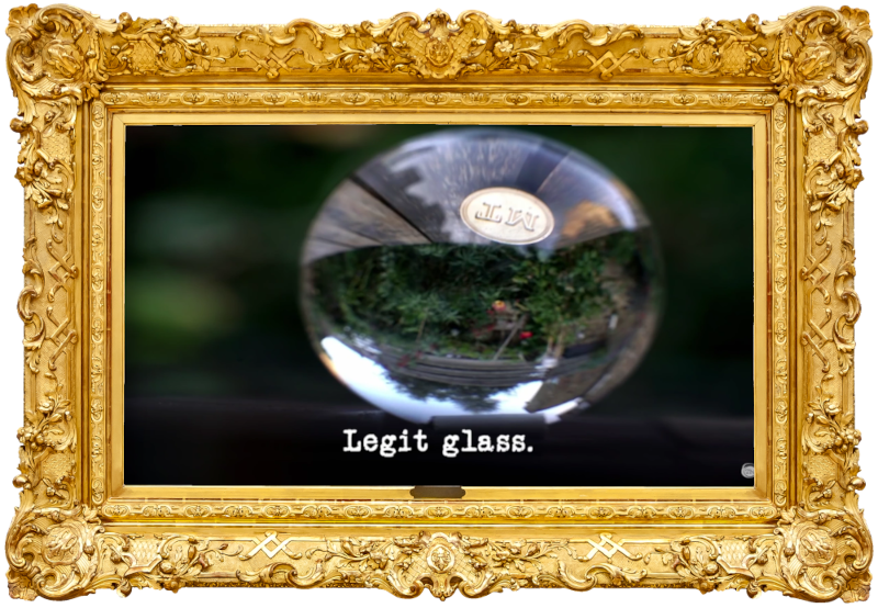 Image of the inverted view through a glass sphere (a reference to the 'Make the best and longest-lasting marble run' task), with the episode title, 'Legit glass', superimposed on it.