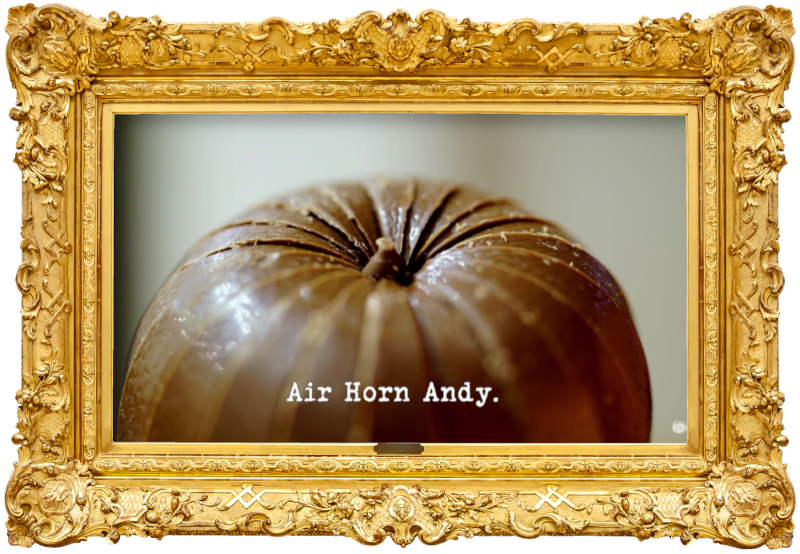 Image of an unwrapped Chocolate Orange (a reference to the 'Complete the most tasks behind the five motorised doors' task), with the episode title, 'Air Horn Andy', superimposed on it.