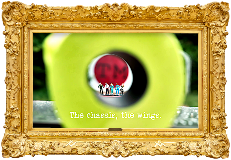 Image of miniature plastic figures of the series' contestants, viewed through the centre of a roll of yellow toilet paper (a reference to the 'Land loo roll in the toilet' task), with the episode title, 'The chassis, the wings', superimposed on it.