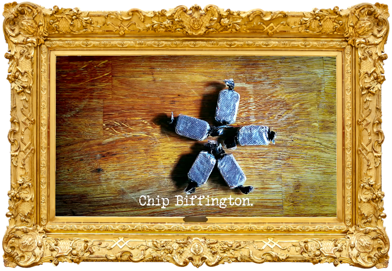 Image of five sweets arranged in a star shape on a wooden surface (a reference to John Kearns' attempt at the 'Get the most pleasure from these rubber chutes' task), with the episode title, 'Chip Biffington', superimposed on it.