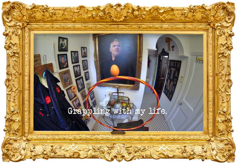 Photo of an egg balanced on a hula hoop, on a plinth in the hallway of the Taskmaster house (referencing the 'Do the riskiest thing with this egg' and 'Hoopla Gary before he crosses the finish line' tasks), with the episode title, 'Grappling with my life', superimposed on it.