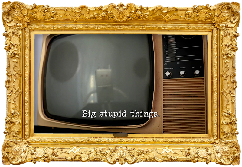 Photo of the screen of an old-fashioned CRT television, with the reflection of a robot on it (referencing the 'Direct the robot to its charging station' and 'Present the most heart-warming final local news story' tasks), with the episode title, 'Big stupid things', superimposed on it.