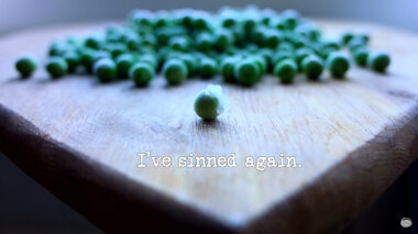 Image of loose frozen peas on a wooden surface (a reference to the 'Find out what’s in the briefcase' task), with the episode title, 'I’ve sinned again', superimposed on it.
