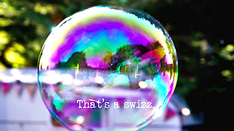 Close-up image of a soap bubble (presumably a reference to footage of the contestants shown during the title sequence), with the episode title, 'That's a swizz', superimposed on it.