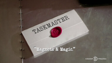 Image of a task brief laid on a metallic surface, with the episode title, 'Magnets & Magic', superimposed on it.
