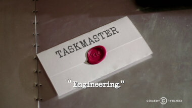 Image of a task brief laid on a metallic surface, with the episode title, 'Engineering', superimposed on it.