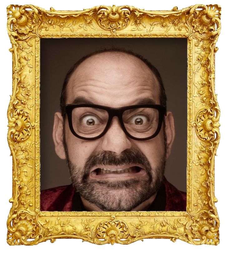 Headshot photo of José Corbacho surrounded with an ornate golden frame.