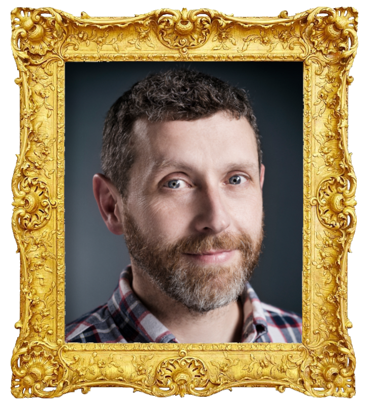 Headshot photo of Dave Gorman surrounded with an ornate golden frame.