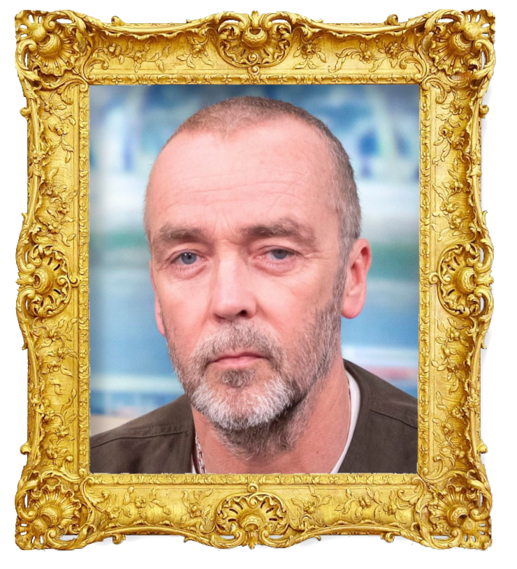 Headshot photo of John Hannah surrounded with an ornate golden frame.