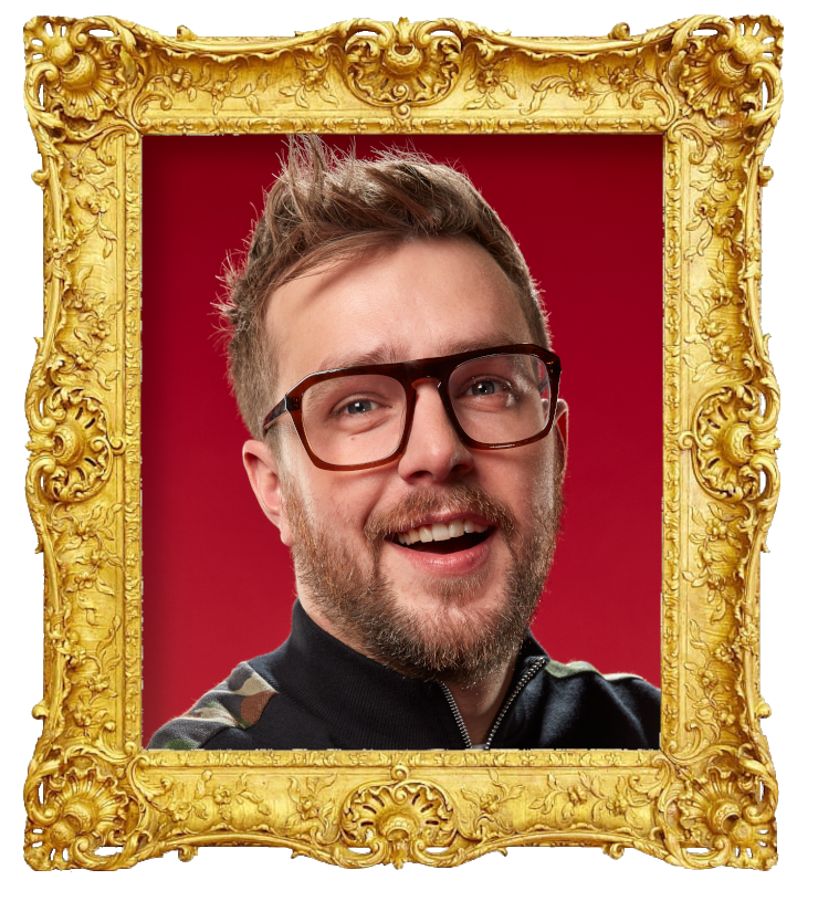 Headshot photo of Iain Stirling surrounded with an ornate golden frame.