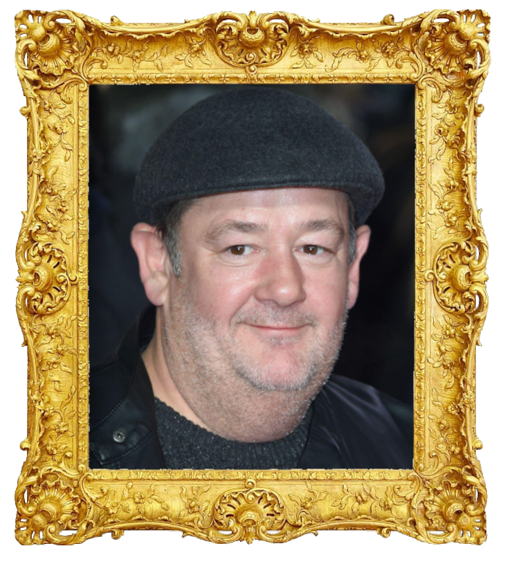 Headshot photo of Johnny Vegas surrounded with an ornate golden frame.