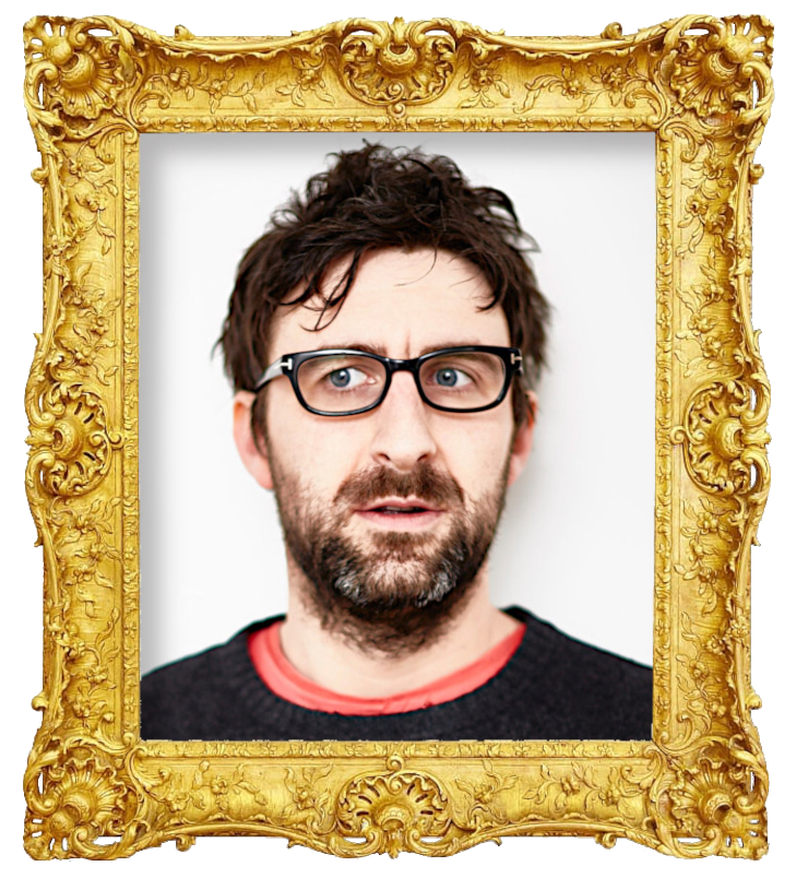 Headshot photo of Mark Watson surrounded with an ornate golden frame.