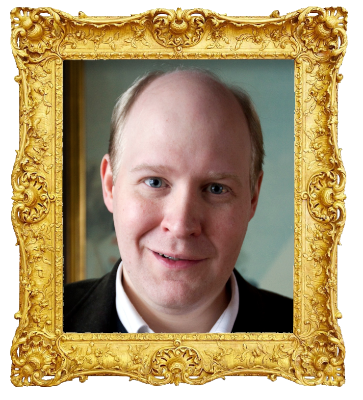 Headshot photo of Henrik Dorsin surrounded with an ornate golden frame.