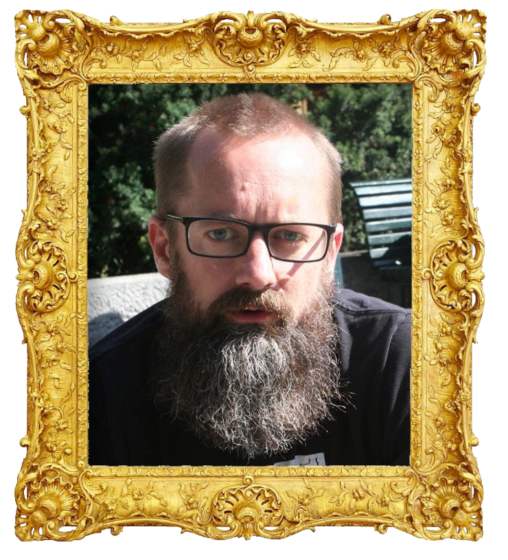 Headshot photo of Egil Hegerberg surrounded with an ornate golden frame.