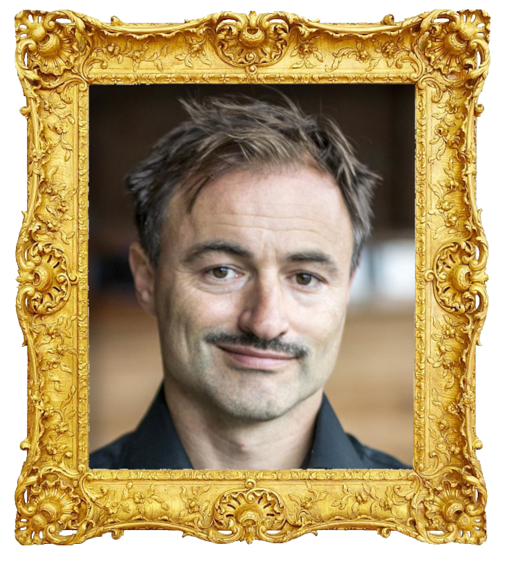 Headshot photo of Dimitri Leue surrounded with an ornate golden frame.