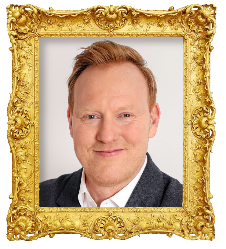 Headshot photo of Anders Breinholt surrounded with an ornate golden frame.