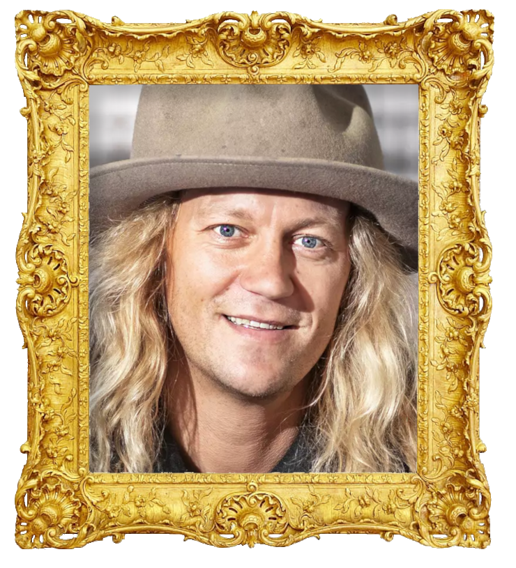 Headshot photo of Jukka Hildén surrounded with an ornate golden frame.