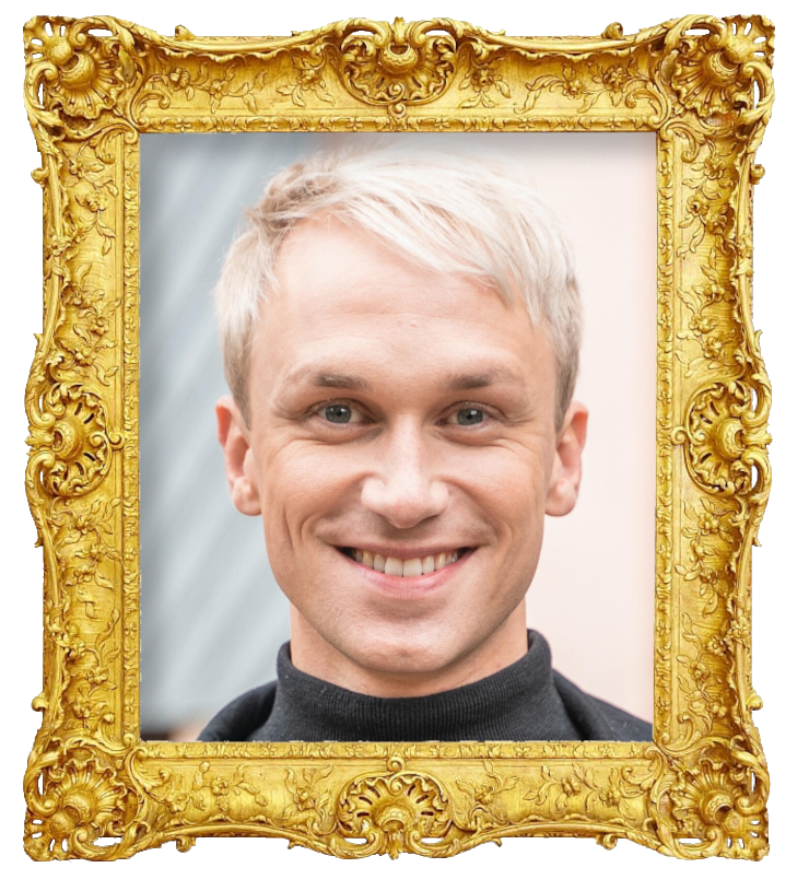 Headshot photo of Christoffer Strandberg surrounded with an ornate golden frame.