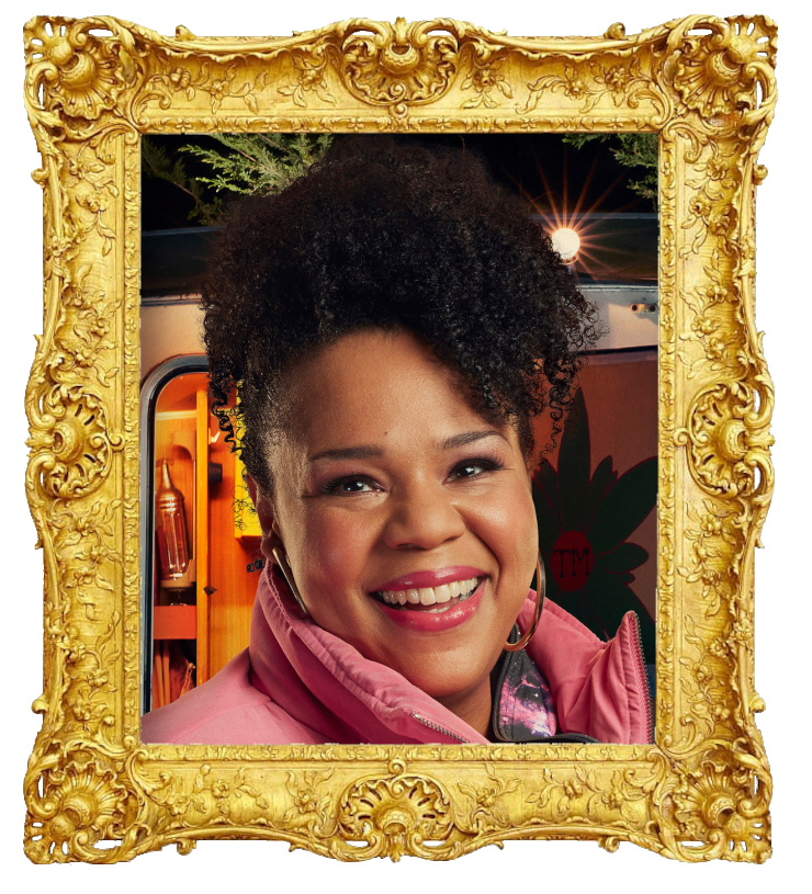 Headshot photo of Desiree Burch surrounded with an ornate golden frame.